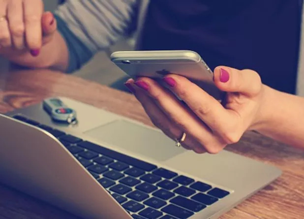 woman's hand using cellphone